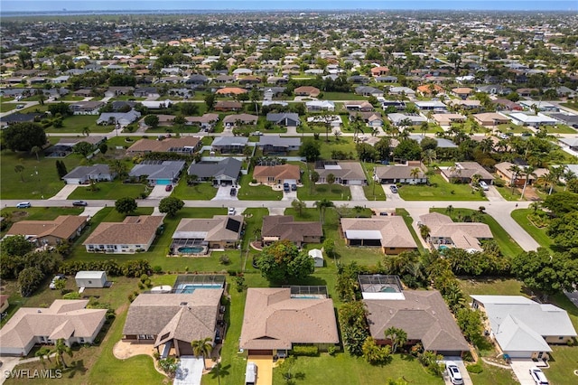1831 SE 6th St, Cape Coral, FL 33990 - aerial view of property and surrounding area with nearby suburban area