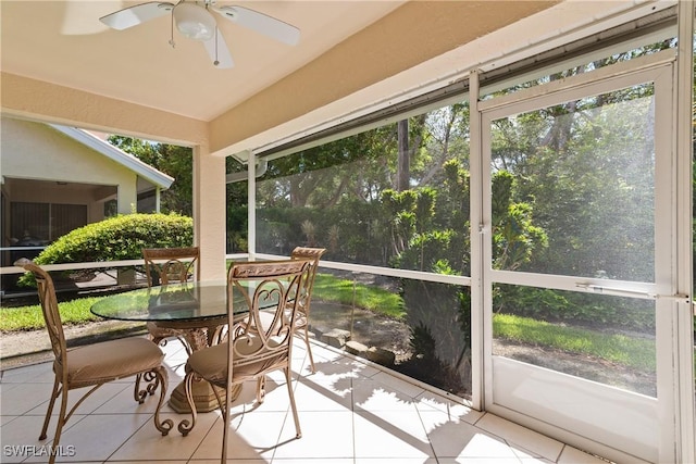 4718 Via Carmen, Naples, FL 34105 - sunroom featuring tile patterned flooring, ceiling fan, outdoor dining area, and plenty of natural light