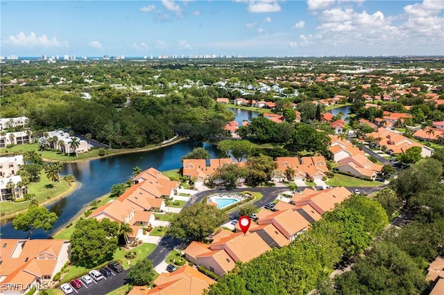 4718 Via Carmen, Naples, FL 34105 - aerial overview of property's location with a large body of water and nearby suburban area