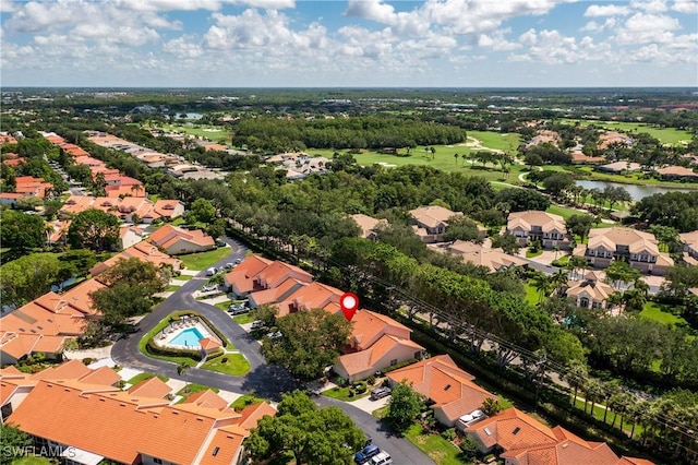 4718 Via Carmen, Naples, FL 34105 - aerial view of property's location with nearby suburban area and a nearby body of water