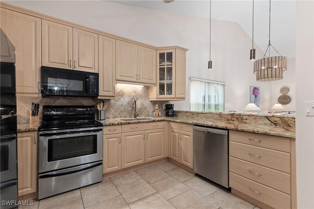 4718 Via Carmen, Naples, FL 34105 - kitchen with appliances with stainless steel finishes, light brown cabinets, and high vaulted ceiling