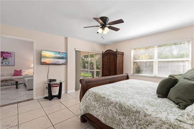 4718 Via Carmen, Naples, FL 34105 - bedroom with light tile patterned floors and ceiling fan