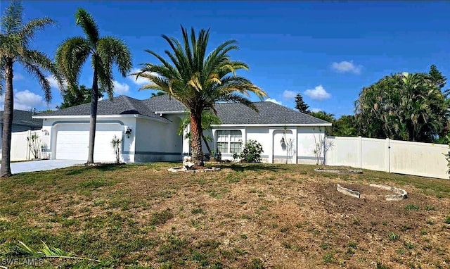 210 NE 9th Place, Cape Coral, FL 33909 - single story home with a garage, stucco siding, and concrete driveway