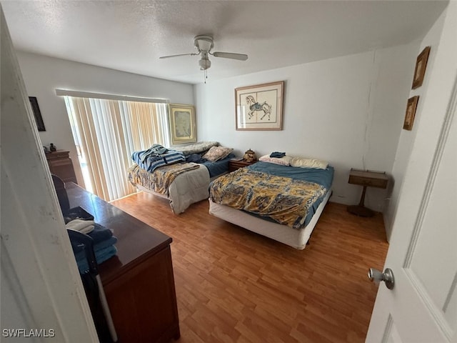 210 NE 9th Place, Cape Coral, FL 33909 - bedroom featuring wood finished floors and ceiling fan