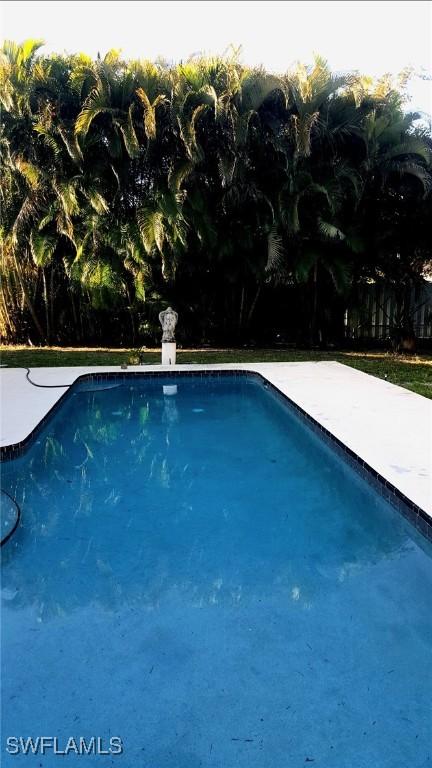 210 NE 9th Place, Cape Coral, FL 33909 - view of swimming pool with a patio