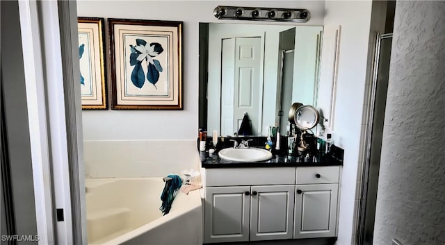 210 NE 9th Place, Cape Coral, FL 33909 - full bath with vanity, a bath, and a stall shower