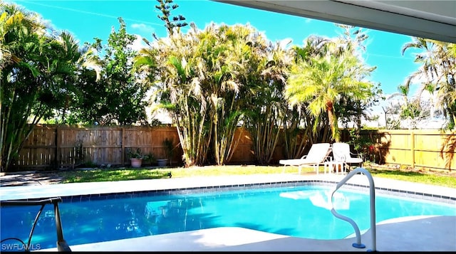 210 NE 9th Place, Cape Coral, FL 33909 - view of swimming pool featuring a fenced backyard