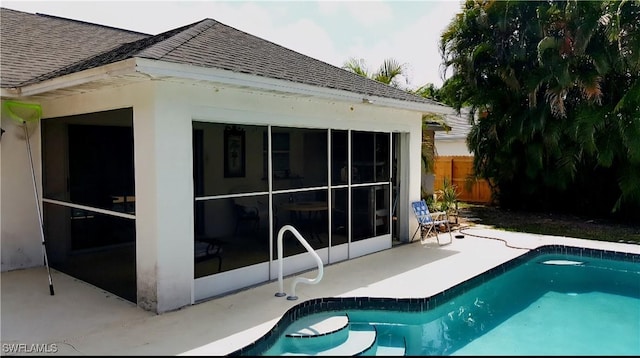 210 NE 9th Place, Cape Coral, FL 33909 - rear view of house with a shingled roof and a patio