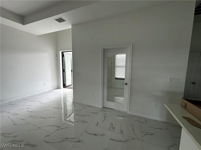 904 James Ave, Lehigh Acres, FL 33936 - spare room with light marble finish flooring