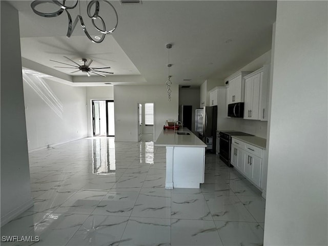 904 James Ave, Lehigh Acres, FL 33936 - kitchen featuring black appliances, open floor plan, white cabinetry, and a raised ceiling