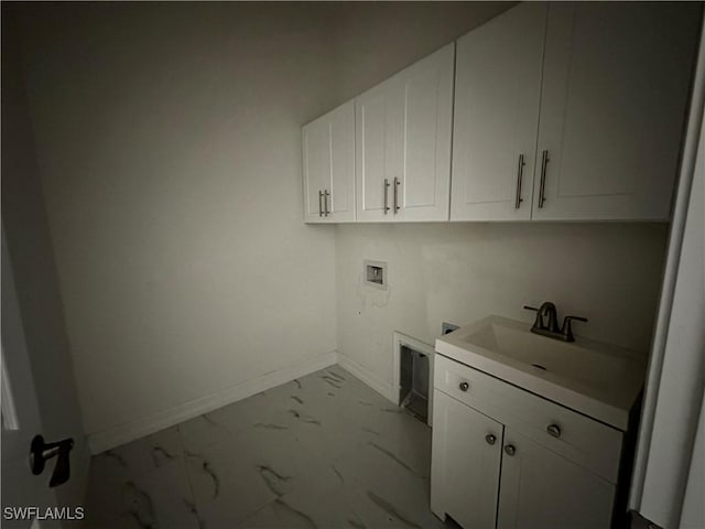 904 James Ave, Lehigh Acres, FL 33936 - washroom with marble look tiles, hookup for a washing machine, cabinet space, and hookup for an electric dryer
