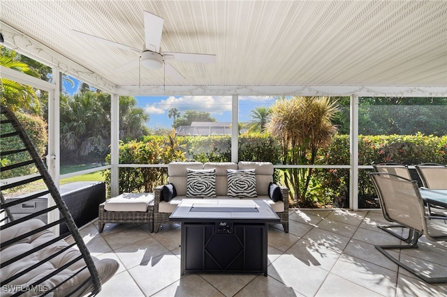 134 Palm River Blvd, Naples, FL 34110 - sunroom featuring a ceiling fan and an outdoor living space with a fire pit