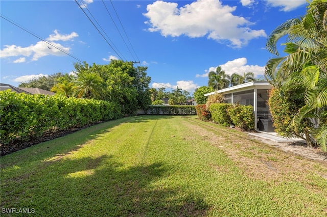 134 Palm River Blvd, Naples, FL 34110 - view of yard featuring a sunroom