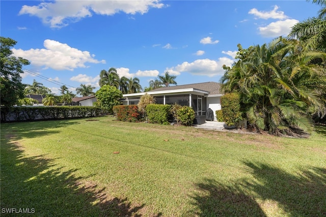 134 Palm River Blvd, Naples, FL 34110 - view of grassy yard featuring a sunroom