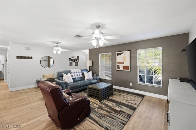 134 Palm River Blvd, Naples, FL 34110 - living room featuring light wood finished floors and ceiling fan