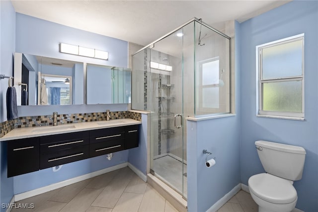 134 Palm River Blvd, Naples, FL 34110 - full bathroom featuring plenty of natural light, double vanity, a stall shower, and backsplash