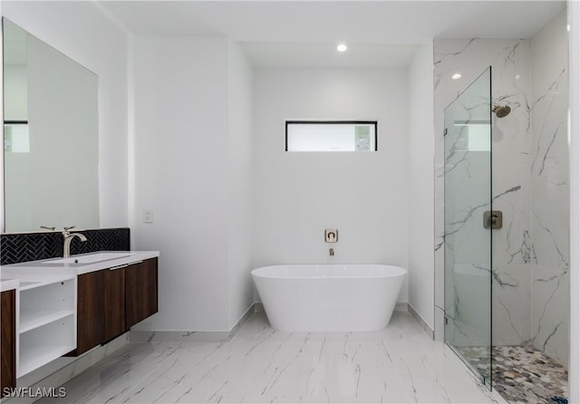 1144 Monday St, Labelle, FL 33935 - bathroom with a marble finish shower, vanity, a freestanding tub, marble finish flooring, and recessed lighting