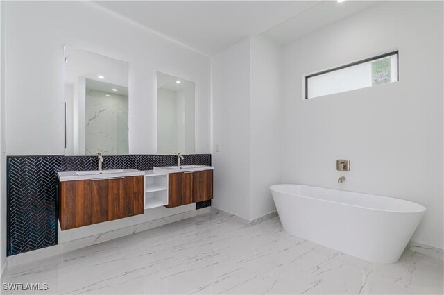 1144 Monday St, Labelle, FL 33935 - bathroom with marble finish flooring, a freestanding tub, double vanity, recessed lighting, and a marble finish shower