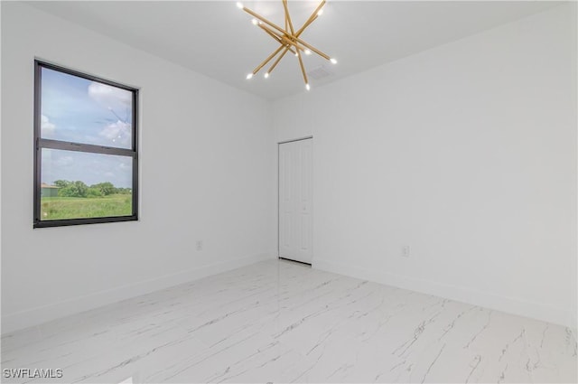1144 Monday St, Labelle, FL 33935 - unfurnished room featuring a chandelier and light marble finish flooring