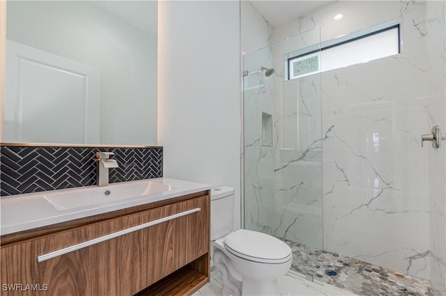 1144 Monday St, Labelle, FL 33935 - bathroom featuring vanity, tasteful backsplash, and a marble finish shower