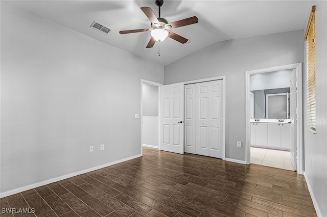 3258 Tamara Dr Unit 2, Naples, FL 34109 - unfurnished bedroom featuring vaulted ceiling, wood finished floors, a closet, ensuite bathroom, and a ceiling fan