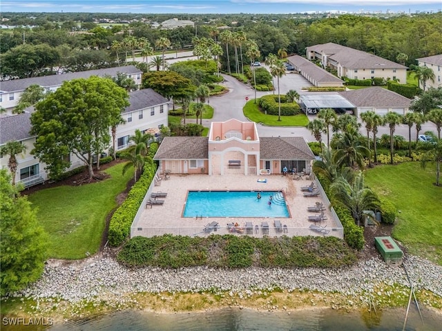 3258 Tamara Dr Unit 2, Naples, FL 34109 - view of subject property with a pool area and a nearby body of water