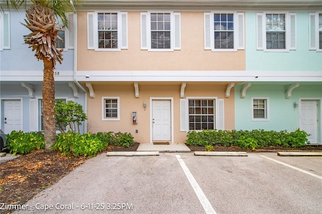 3258 Tamara Dr Unit 2, Naples, FL 34109 - multi unit property featuring stucco siding and uncovered parking