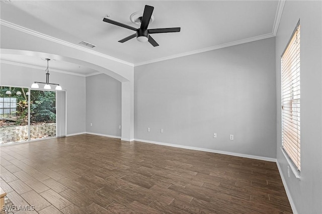 3258 Tamara Dr Unit 2, Naples, FL 34109 - unfurnished room featuring ceiling fan, dark wood-style flooring, arched walkways, and ornamental molding