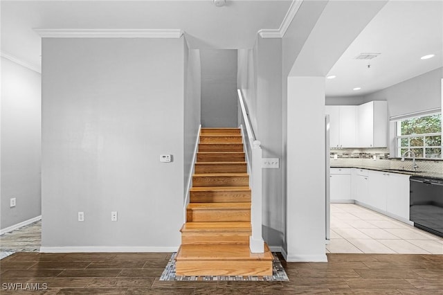 3258 Tamara Dr Unit 2, Naples, FL 34109 - stairway with ornamental molding, wood finished floors, and recessed lighting