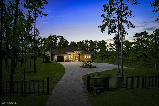 1912 Jung Blvd E, Naples, FL 34120 - view of front of house with decorative driveway and an attached garage