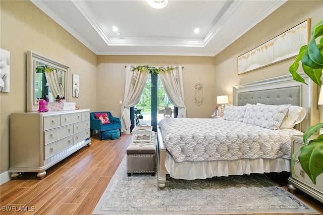 1912 Jung Blvd E, Naples, FL 34120 - bedroom with a tray ceiling, wood finished floors, access to outside, and crown molding