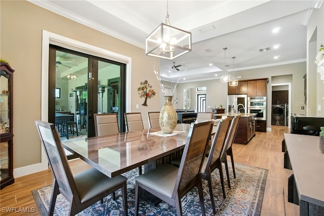 1912 Jung Blvd E, Naples, FL 34120 - dining room with washer / dryer, light wood-type flooring, crown molding, a ceiling fan, and a chandelier