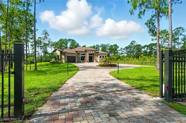 1912 Jung Blvd E, Naples, FL 34120 - view of front of home with decorative driveway and an attached garage
