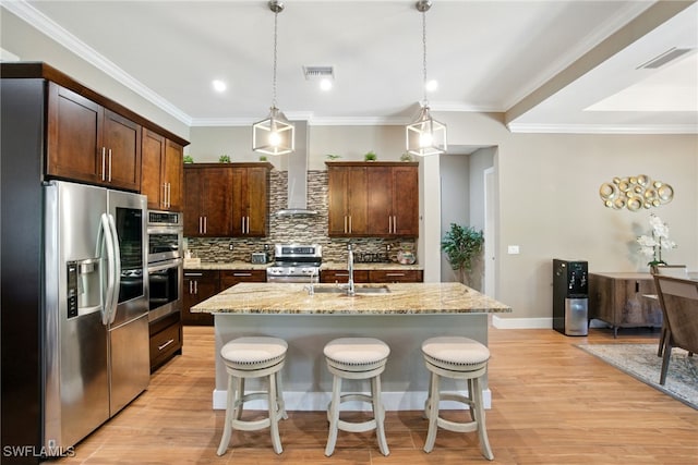 1912 Jung Blvd E, Naples, FL 34120 - kitchen with appliances with stainless steel finishes, backsplash, light stone counters, a kitchen bar, and dark brown cabinets