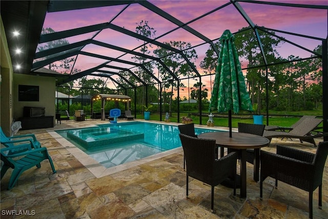 1912 Jung Blvd E, Naples, FL 34120 - view of pool featuring a patio area, a pool with connected hot tub, and glass enclosure