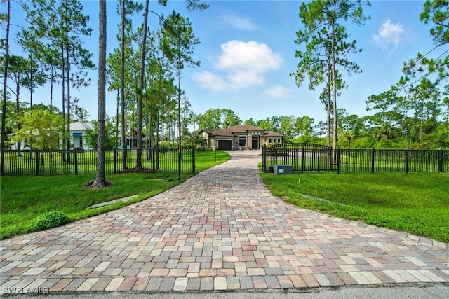 1912 Jung Blvd E, Naples, FL 34120 - view of property's community with decorative driveway and a fenced front yard