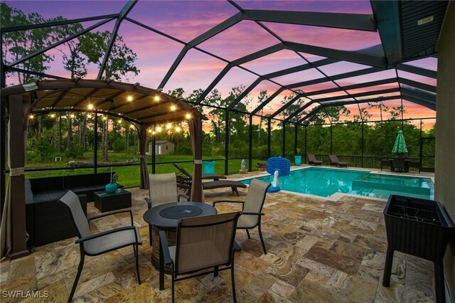 1912 Jung Blvd E, Naples, FL 34120 - swimming pool with a patio, an outdoor living space with a fire pit, and a lanai
