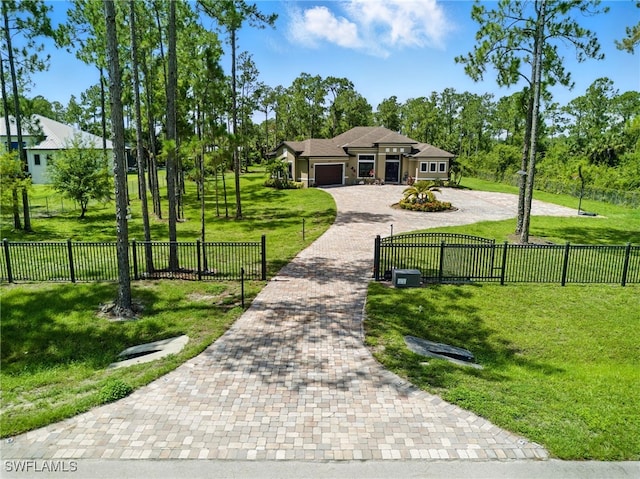 1912 Jung Blvd E, Naples, FL 34120 - view of home's community with decorative driveway, a garage, and a fenced front yard