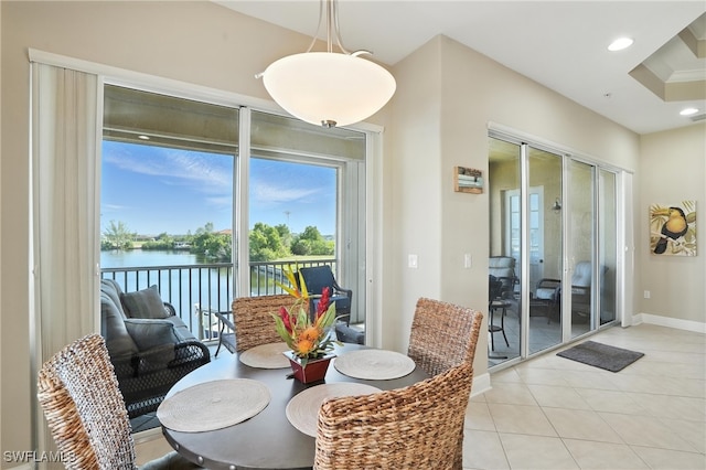 178 Shadroe Cove Cir Unit 903, Cape Coral, FL 33991 - dining room with french doors, light tile patterned floors, a water view, and recessed lighting