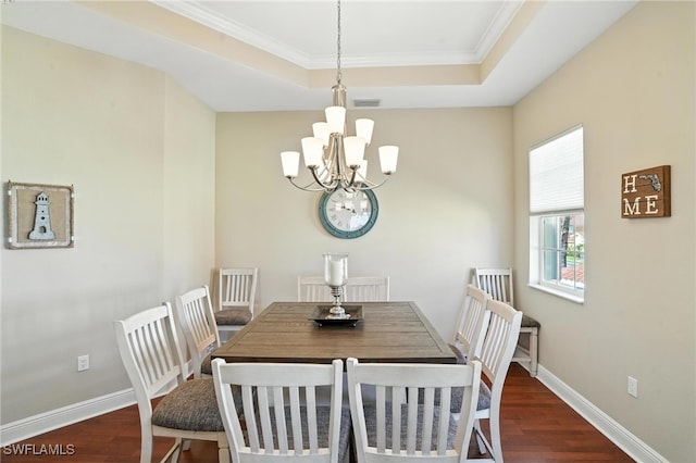 178 Shadroe Cove Cir Unit 903, Cape Coral, FL 33991 - dining space featuring a chandelier, dark wood-style flooring, a raised ceiling, and ornamental molding