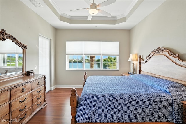 178 Shadroe Cove Cir Unit 903, Cape Coral, FL 33991 - bedroom featuring dark wood-style floors, ornamental molding, a raised ceiling, and a ceiling fan