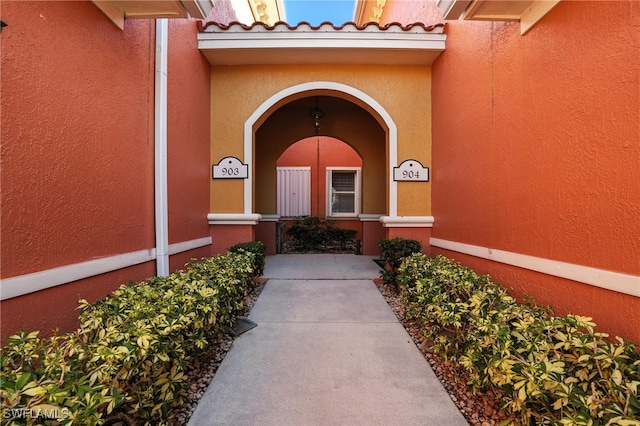 178 Shadroe Cove Cir Unit 903, Cape Coral, FL 33991 - property entrance featuring stucco siding, covered porch, and a tiled roof