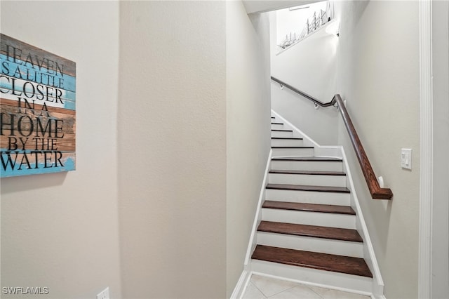 178 Shadroe Cove Cir Unit 903, Cape Coral, FL 33991 - stairway with tile patterned floors and baseboards