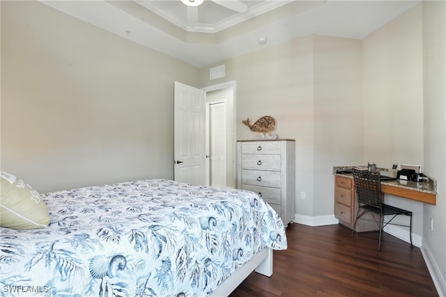 178 Shadroe Cove Cir Unit 903, Cape Coral, FL 33991 - bedroom with dark wood-style floors, a tray ceiling, a desk, ornamental molding, and a ceiling fan
