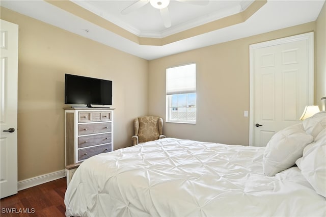 178 Shadroe Cove Cir Unit 903, Cape Coral, FL 33991 - bedroom with dark wood-type flooring, a tray ceiling, crown molding, and a ceiling fan