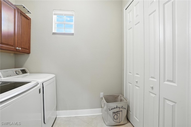 178 Shadroe Cove Cir Unit 903, Cape Coral, FL 33991 - washroom featuring cabinet space, washer and clothes dryer, and light tile patterned flooring