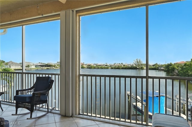 178 Shadroe Cove Cir Unit 903, Cape Coral, FL 33991 - sunroom / solarium featuring tile patterned flooring and a water view
