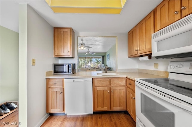 1018 Manatee Rd Unit E302, Naples, FL 34114 - kitchen with white appliances, light wood finished floors, light countertops, and a ceiling fan