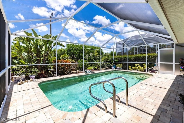 6769 Berwick Pl, Naples, FL 34104 - swimming pool with a patio area and glass enclosure