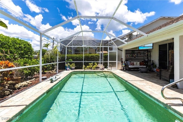 6769 Berwick Pl, Naples, FL 34104 - outdoor pool featuring a patio area and glass enclosure